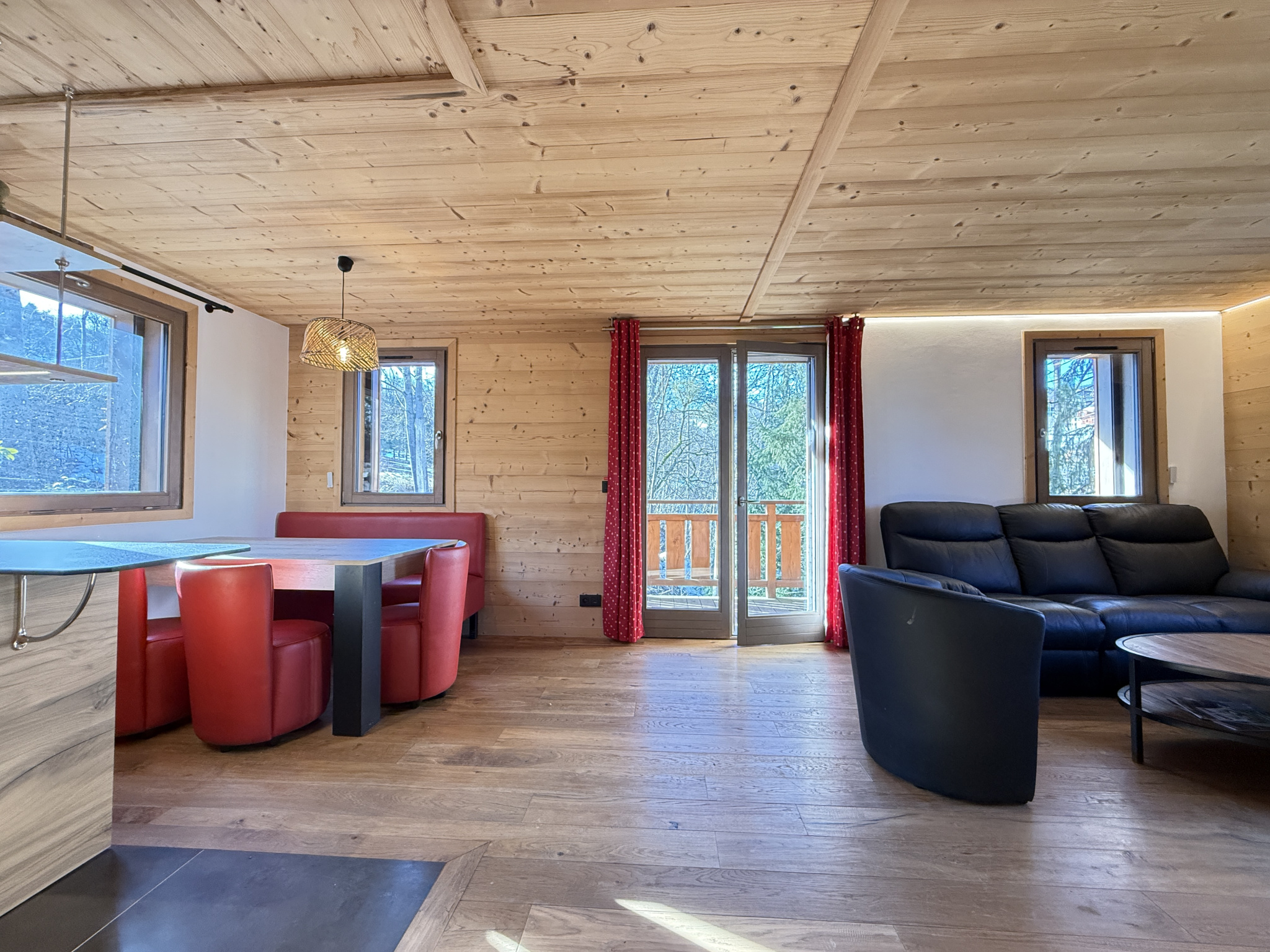 Interior of a chalet in Combloux Interior of an alpine chalet with a dining area and a comfortable living room.