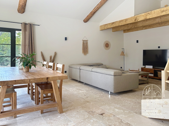 Interior of a renovated Provençal farmhouse with living room and dining room, Châteaurenard.