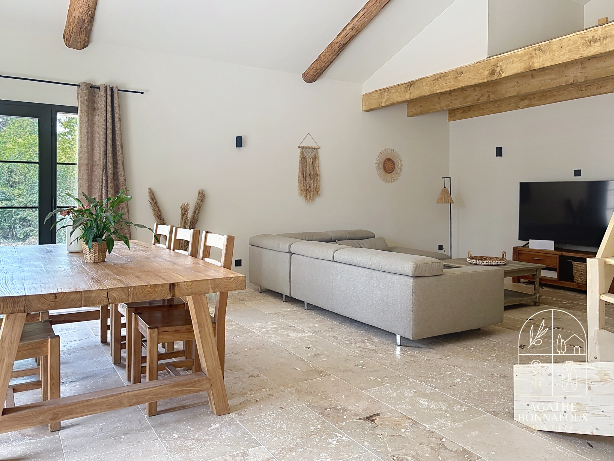Interior of a renovated Provençal farmhouse with living room and dining room, Châteaurenard.
