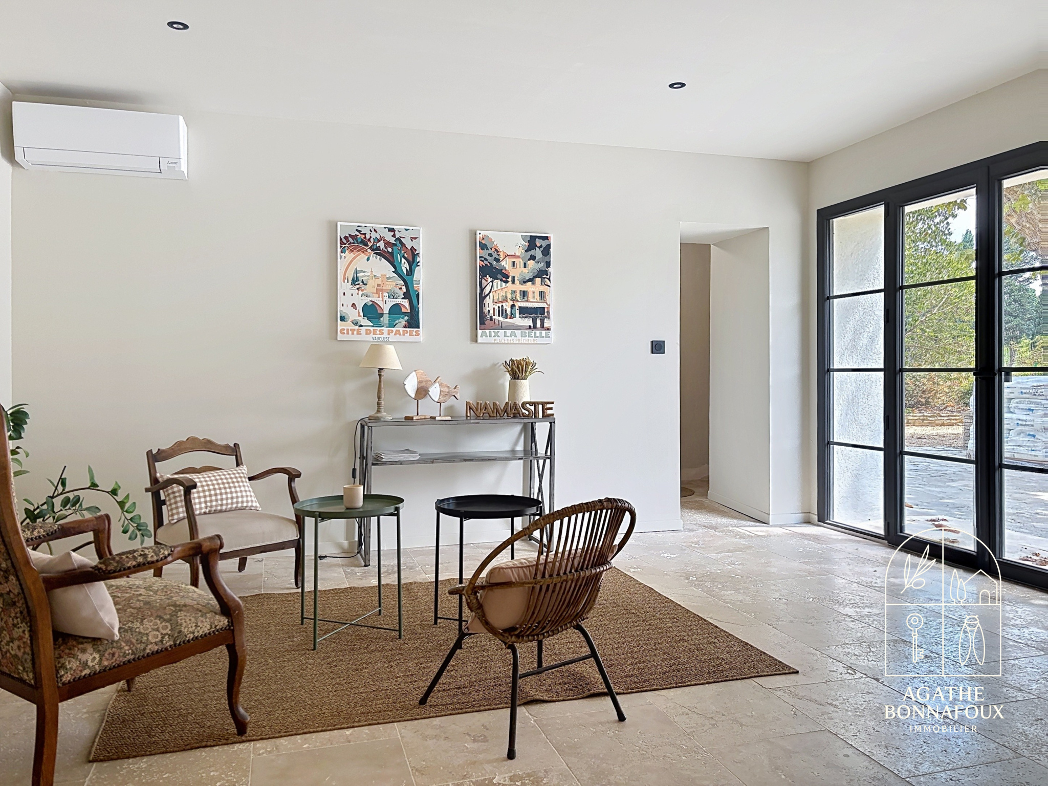 Interior of a renovated Provençal farmhouse with elegant furniture and modern decor.