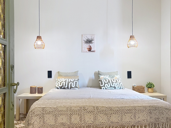 Room in a renovated Provençal farmhouse with double bed and elegant decor.