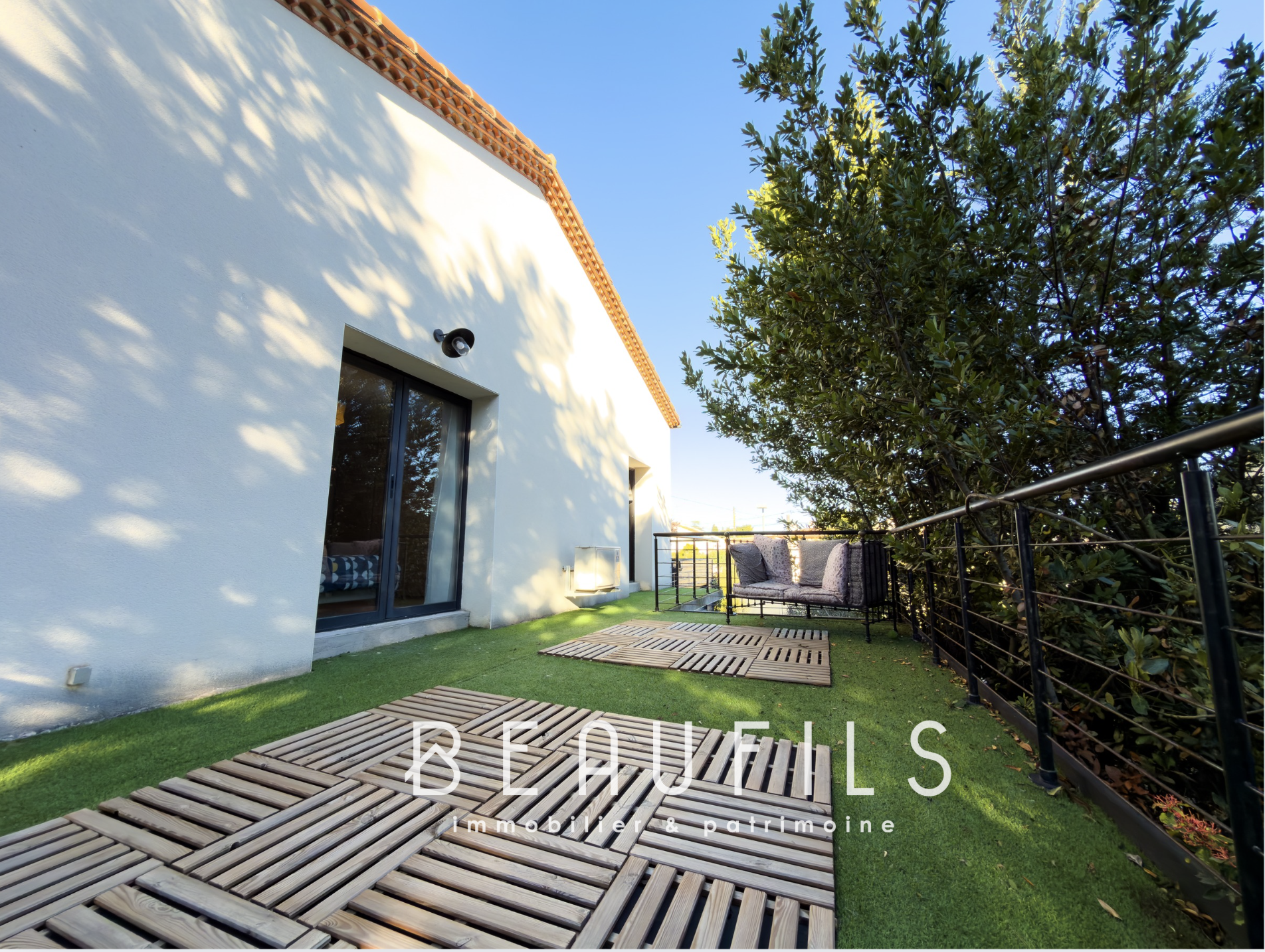 Terrace of a renovated villa with relaxation area in Frontignan.