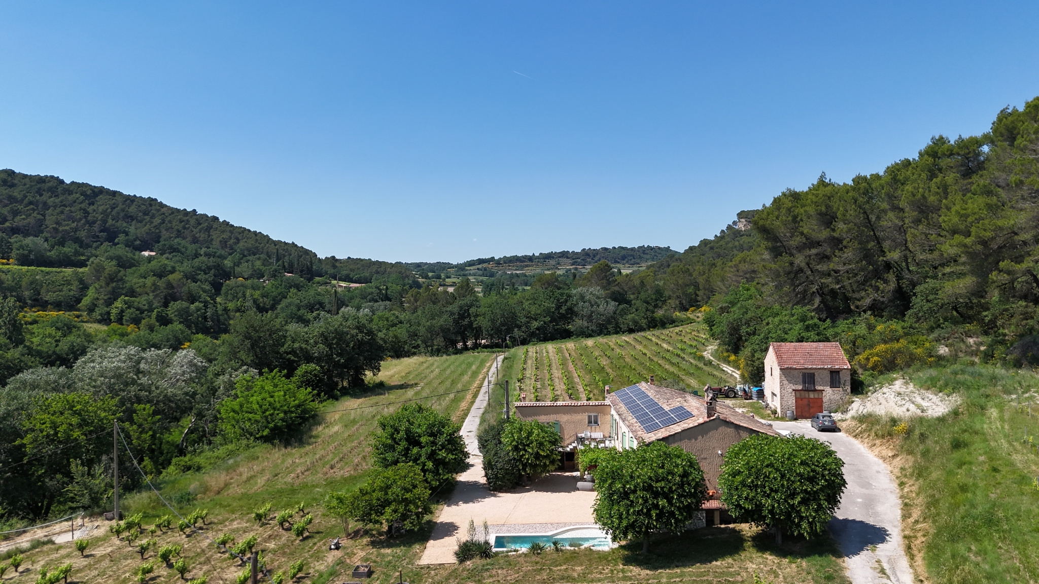 Property with gîte and swimming pool in Faucon Aerial view of a property with a gîte, bed and breakfast and swimming pool surrounded by vineyards in Faucon.