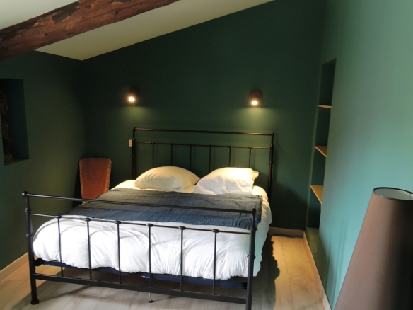 Guest room with double bed and modern decor in a property in Provence.