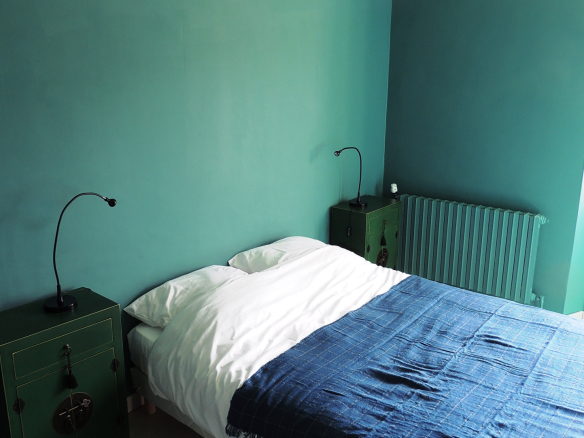 Guest room with double bed and modern decor in a property in Provence.