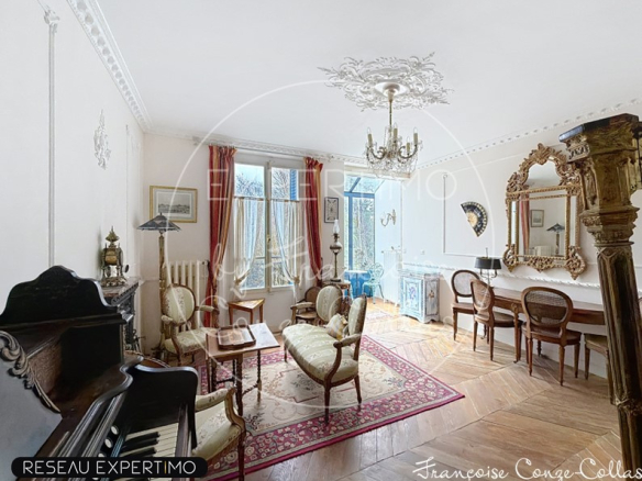 Interior of a millstone house with living room, piano and antique furniture.