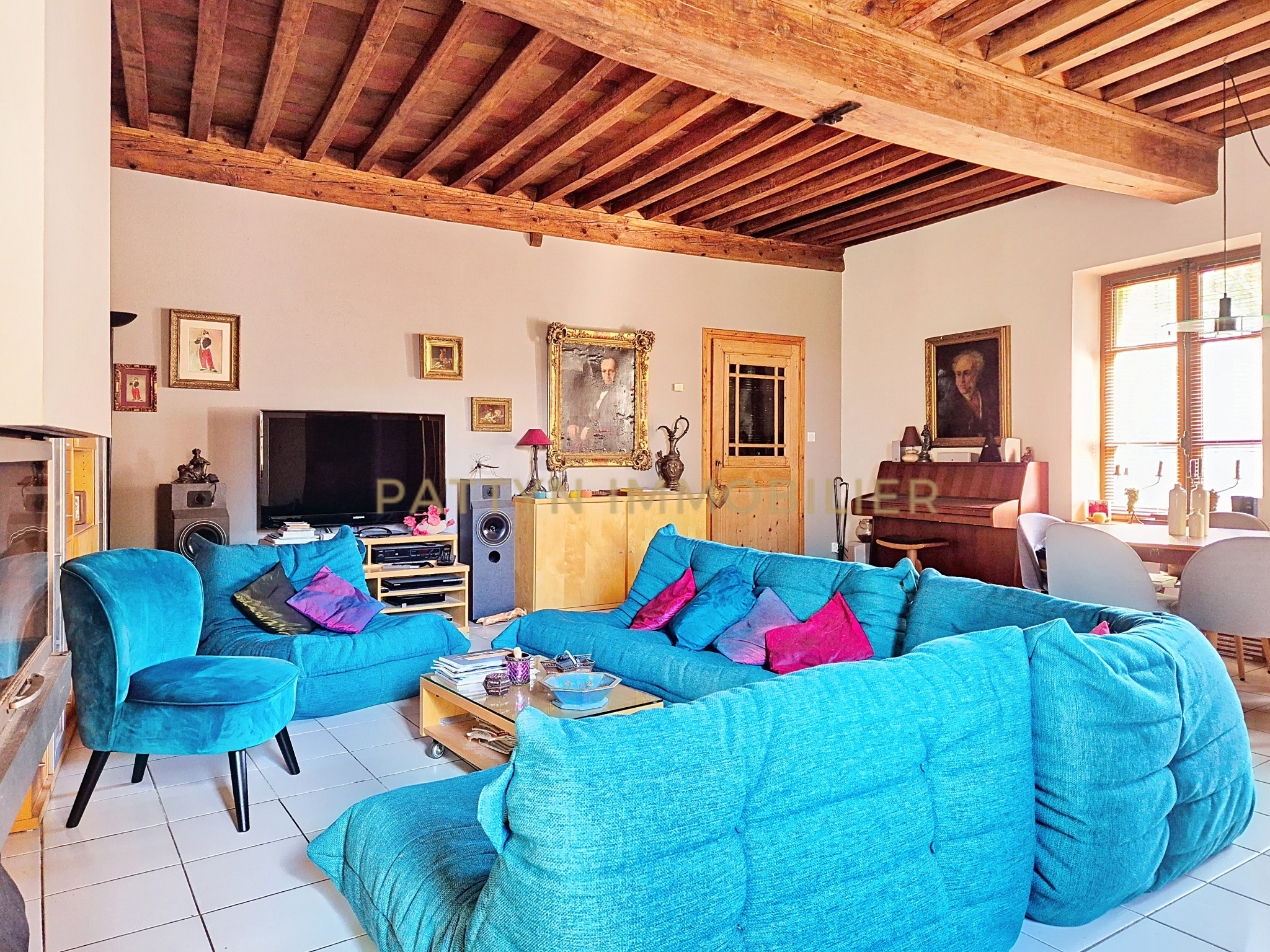 Living room of a house in Tramoyes Interior of a house in Tramoyes with a spacious living room and comfortable furniture.