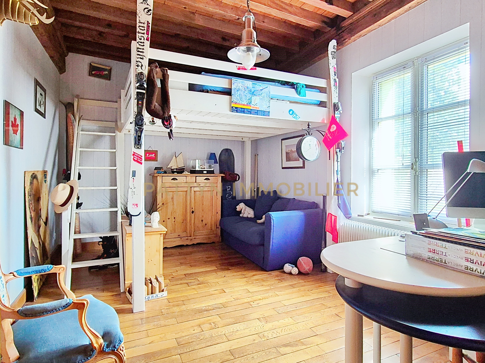 Interior of a house in Tramoyes Interior of a house with a living area, a workspace and a mezzanine.