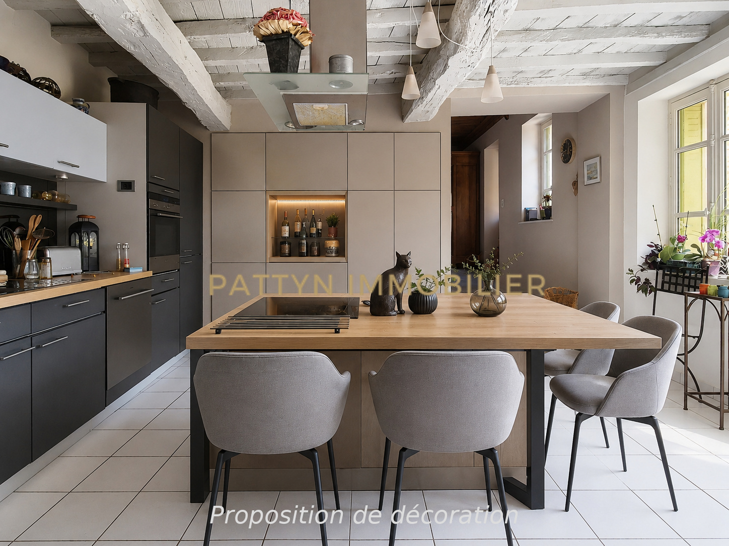 Modern cuisine in Tramoyes Modern kitchen with wooden table and grey chairs, decorated with plants and art objects.