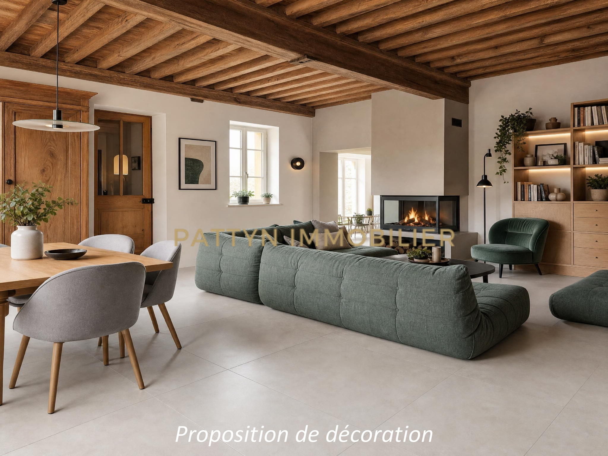 Interior of a house in Tramoyes Interior of a modern house with a spacious living room, a fireplace and a dining table.