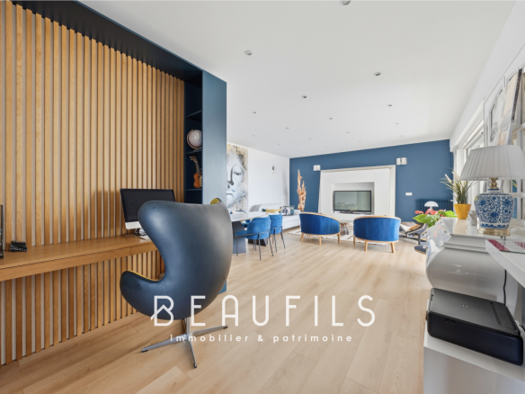 Interior of a modern apartment with contemporary furniture and a sea view.