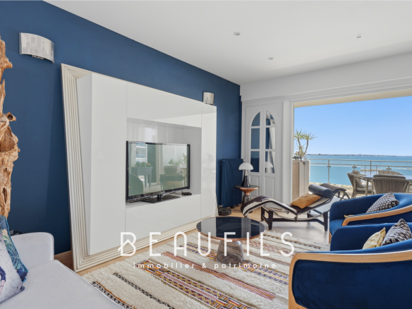Interior of a renovated apartment with sea view, modern and bright living room.