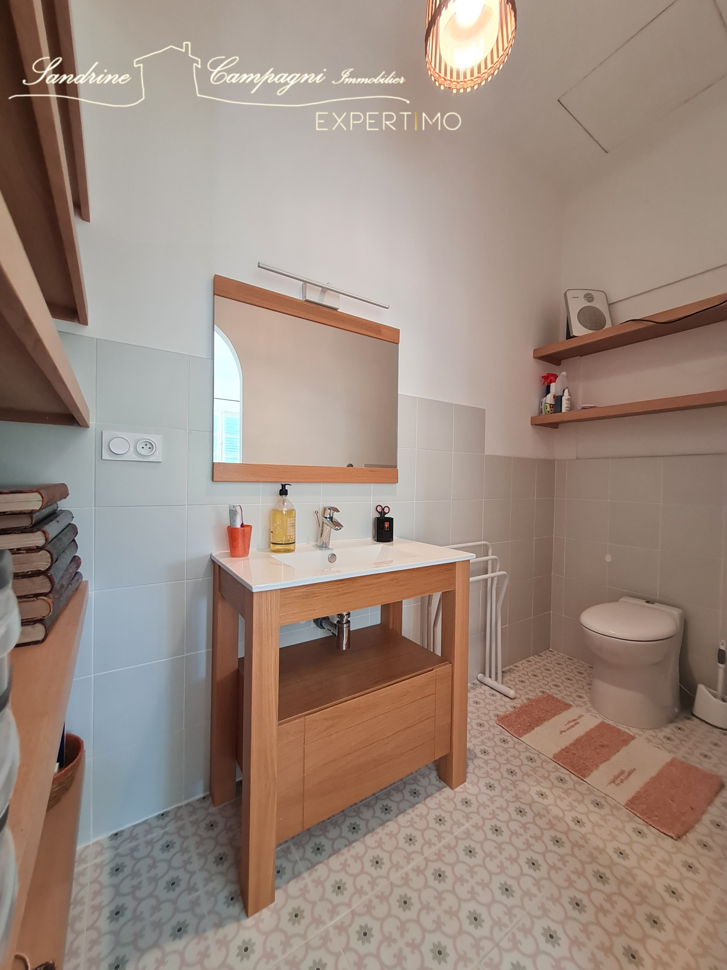 Modern bathroom with wooden sink and decorative tiles