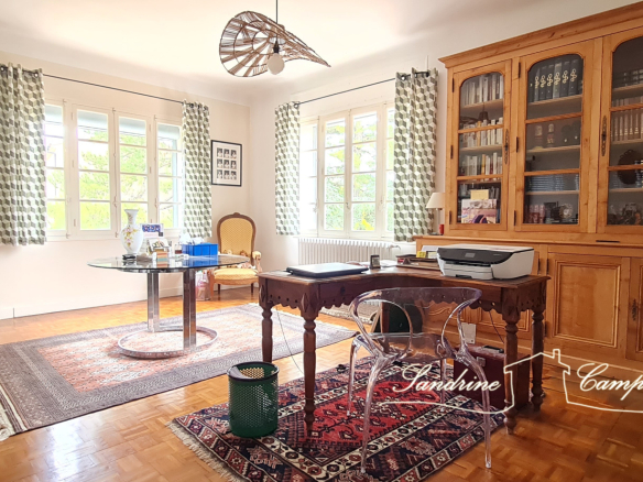 Interior of a renovated house with an office and a bright living room in Mazan.