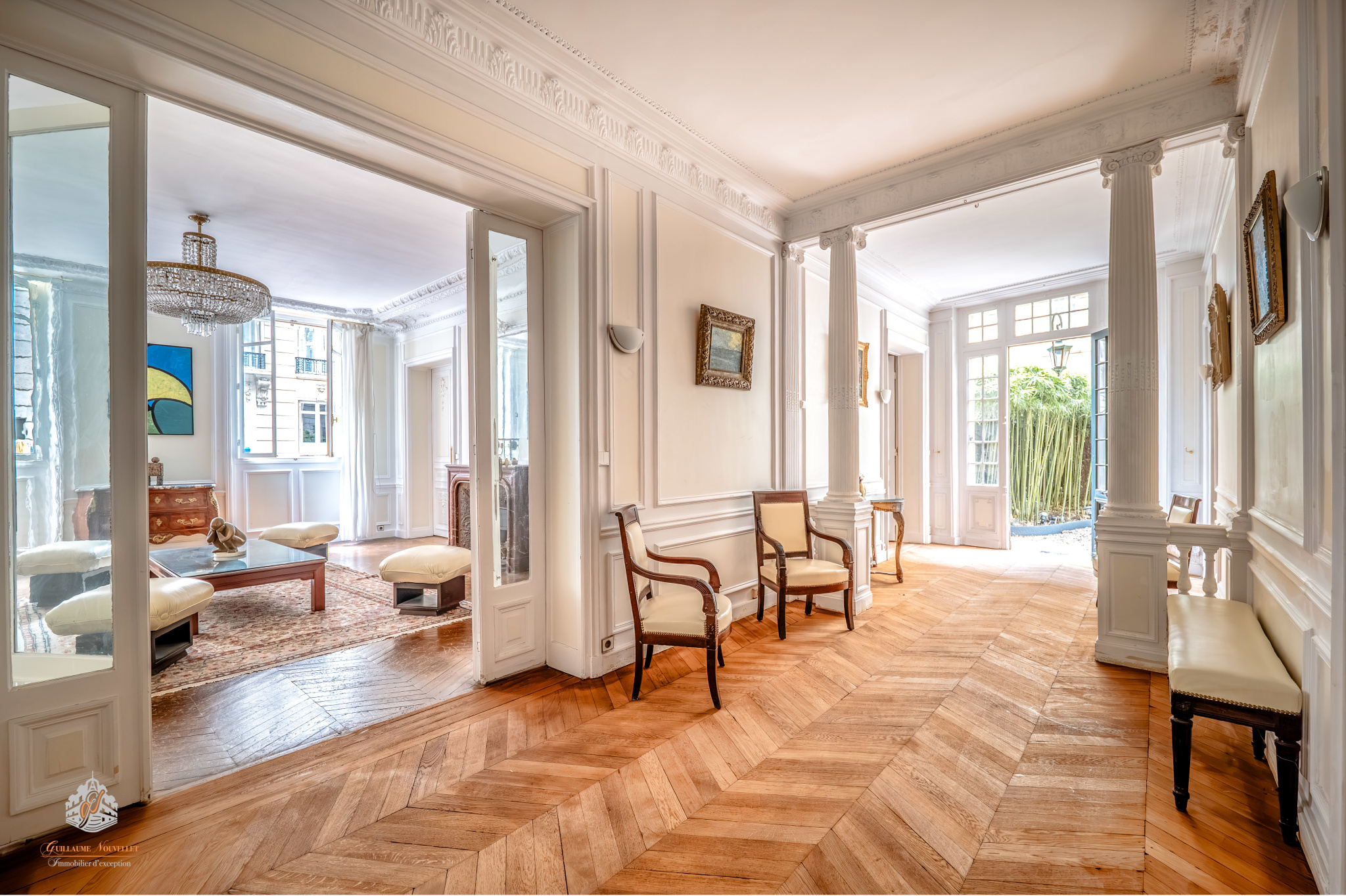 Elegant interior of a garden-level apartment in the 17th arrondissement of Paris Interior of an elegant ground-floor apartment in Paris' 17th arrondissement with wooden parquet flooring and natural light.