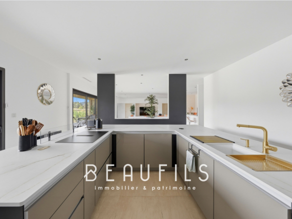 Modern and spacious villa kitchen, with marble worktops and high-end appliances.
