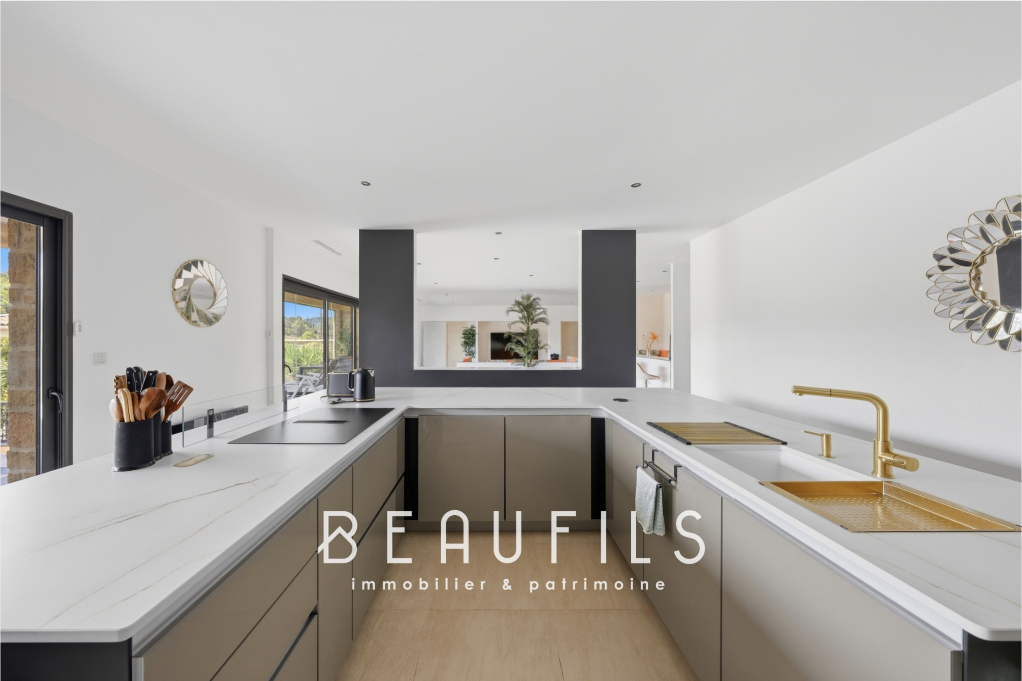 Modern and spacious villa kitchen, with marble worktops and high-end appliances.