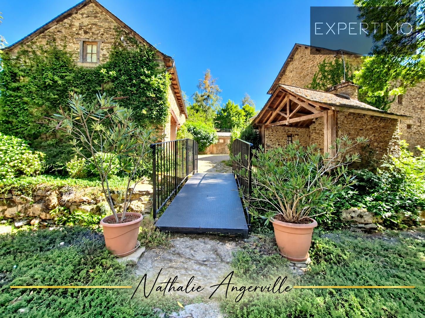 Exceptional property in Salmiech View of a property with an old mill and a gîte, surrounded by greenery in Salmiech.