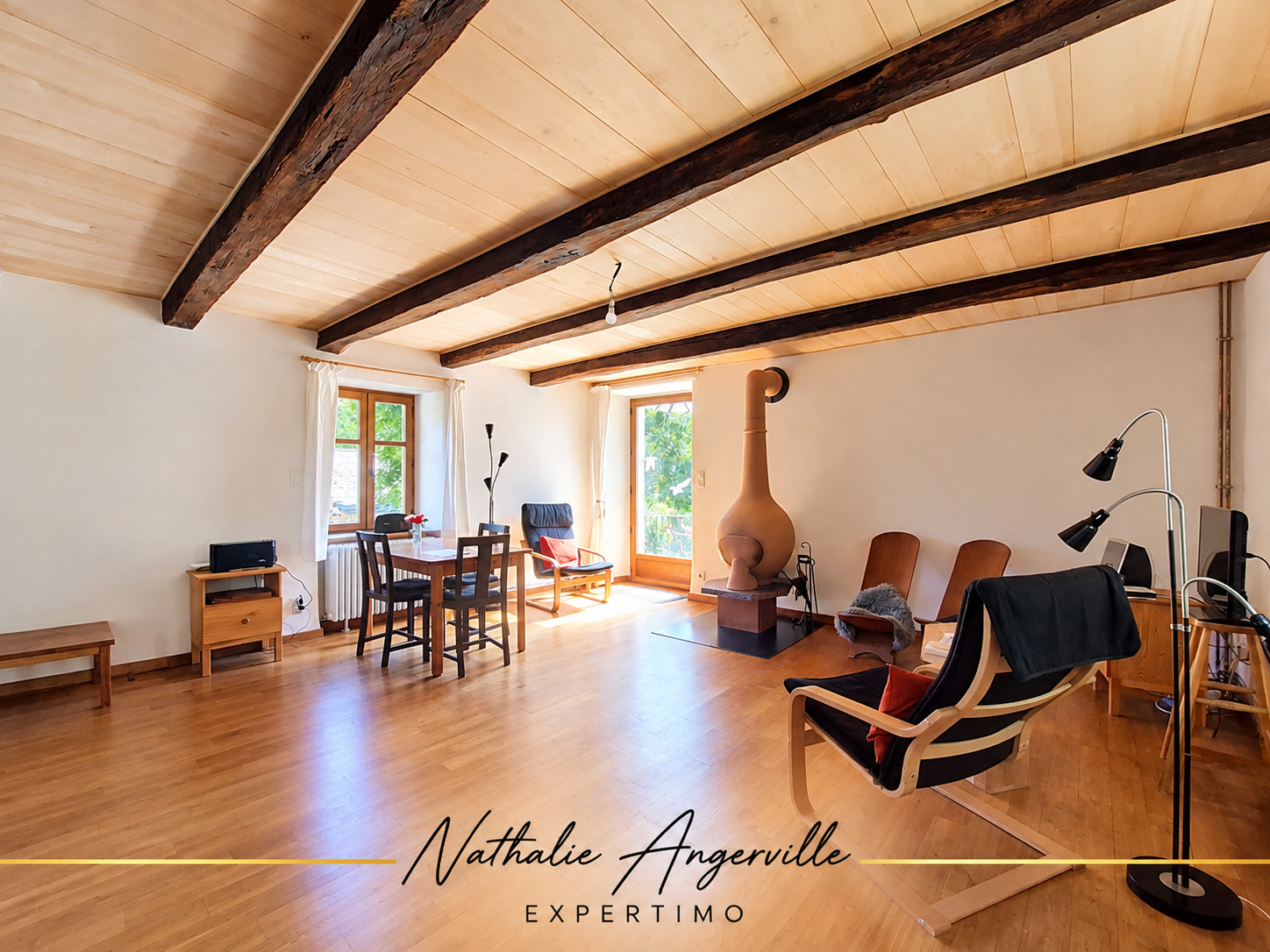 Interior of a property with a fireplace Interior of a property with a spacious living room, fireplace and modern furniture.