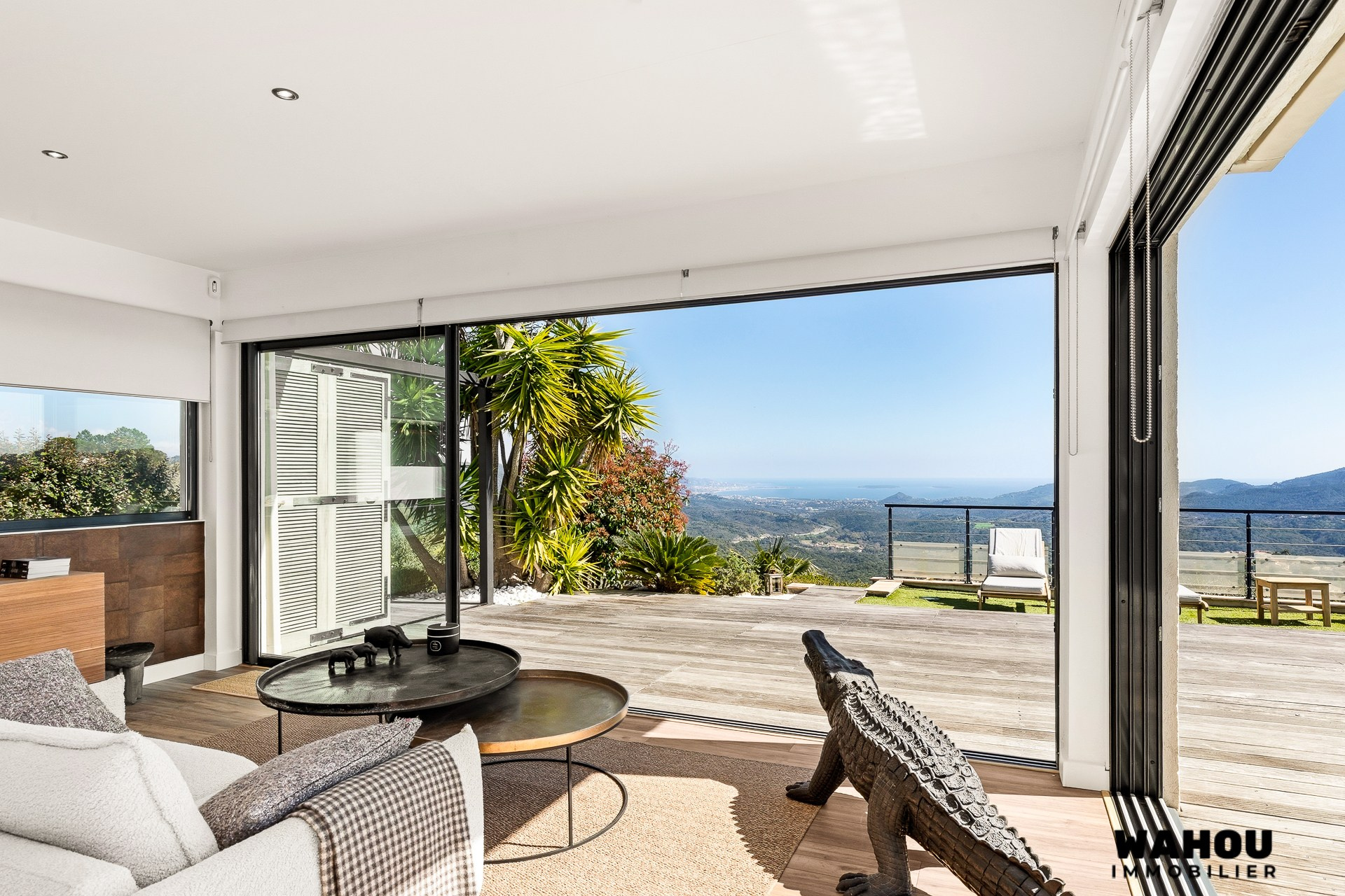 Interior of a modern villa with views of nature and the Bay of Cannes.