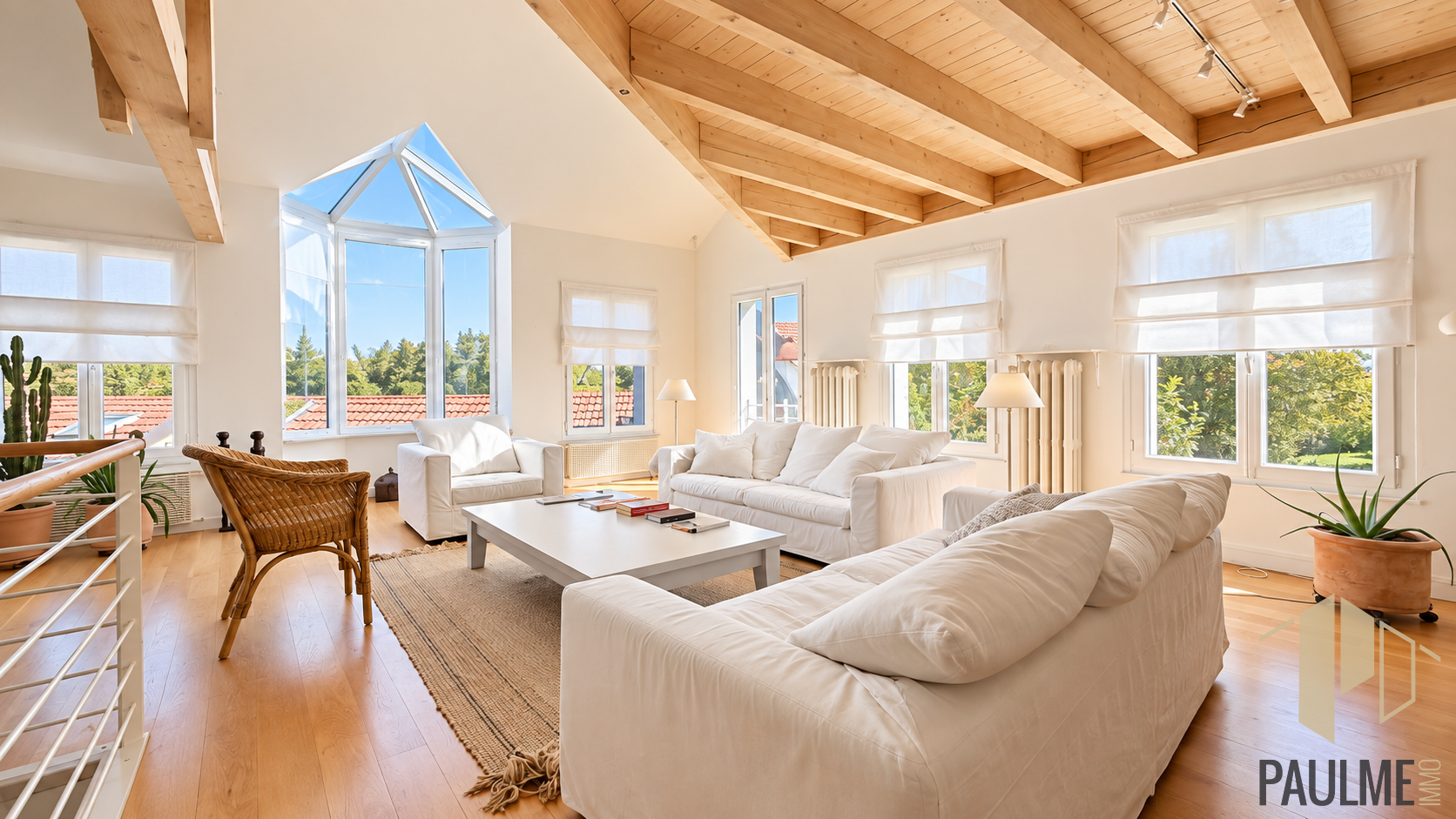 Bright living room of a stone house in Sergy Interior of a stone house with a bright living room and high windows.