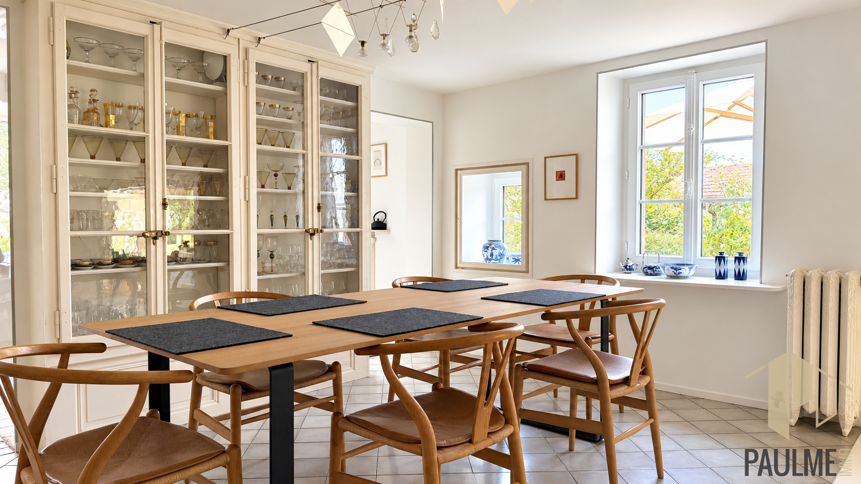 Dining room of a stone house in Sergy Interior of a stone house with a bright dining room and wooden chairs.