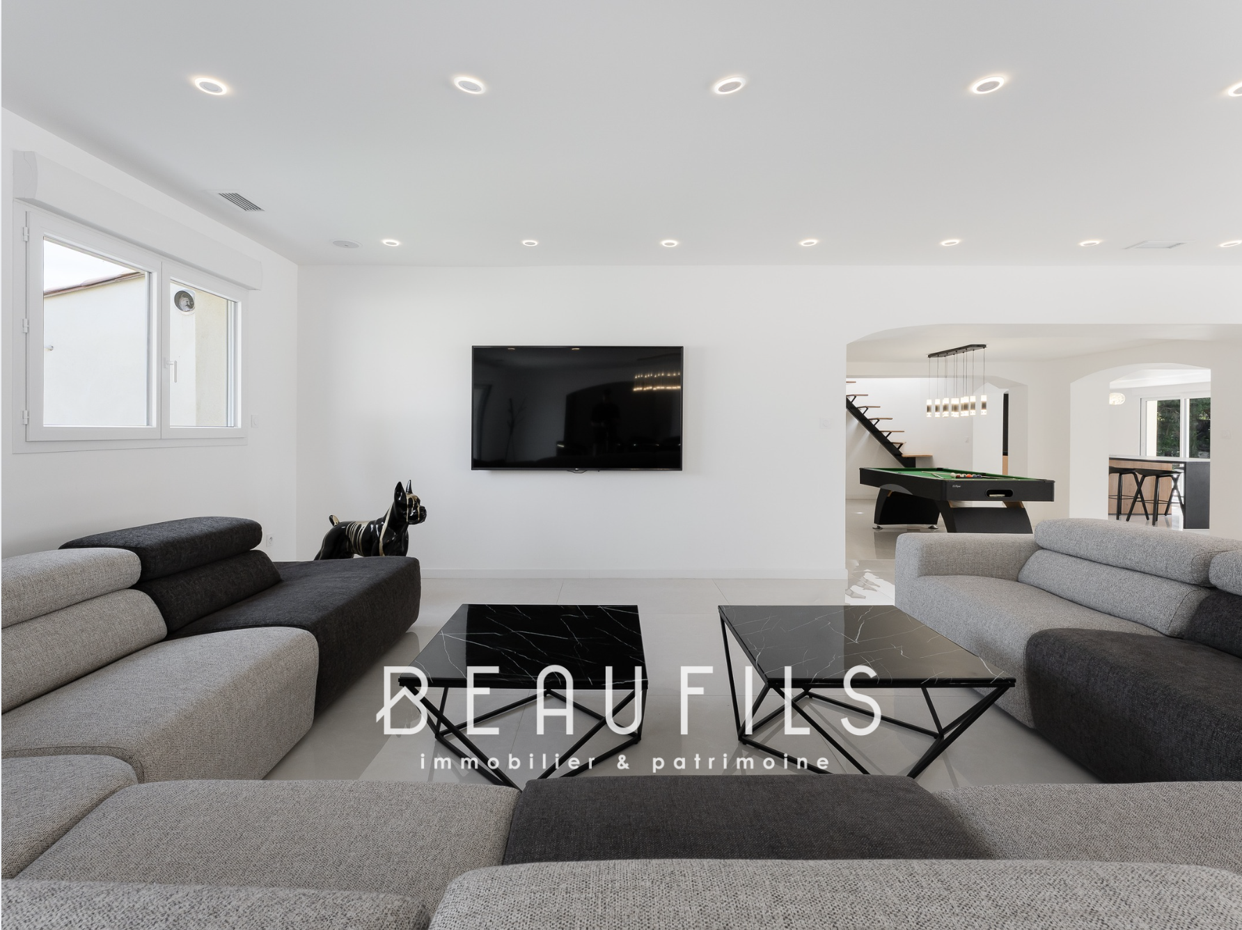 Modern interior of a neo-Provencal farmhouse Interior of a renovated neo-Provençal farmhouse with a modern living room and billiard area.