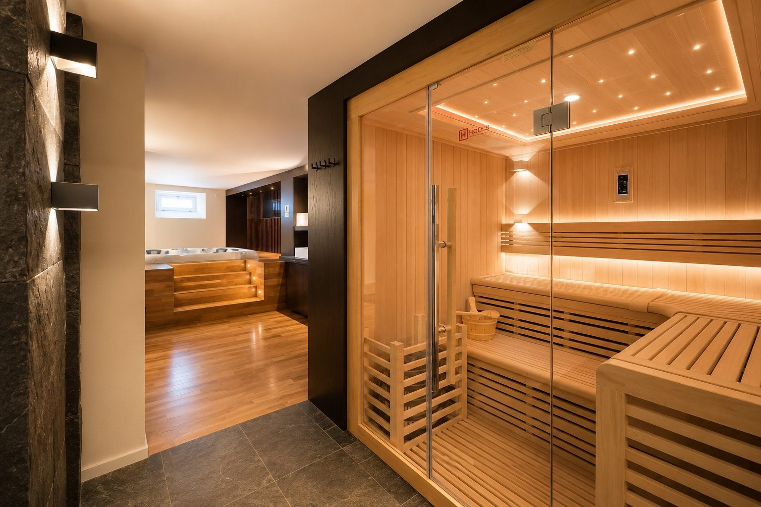Spa privatif avec sauna à Munster Intérieur d'un spa privatif avec sauna en bois et coin détente