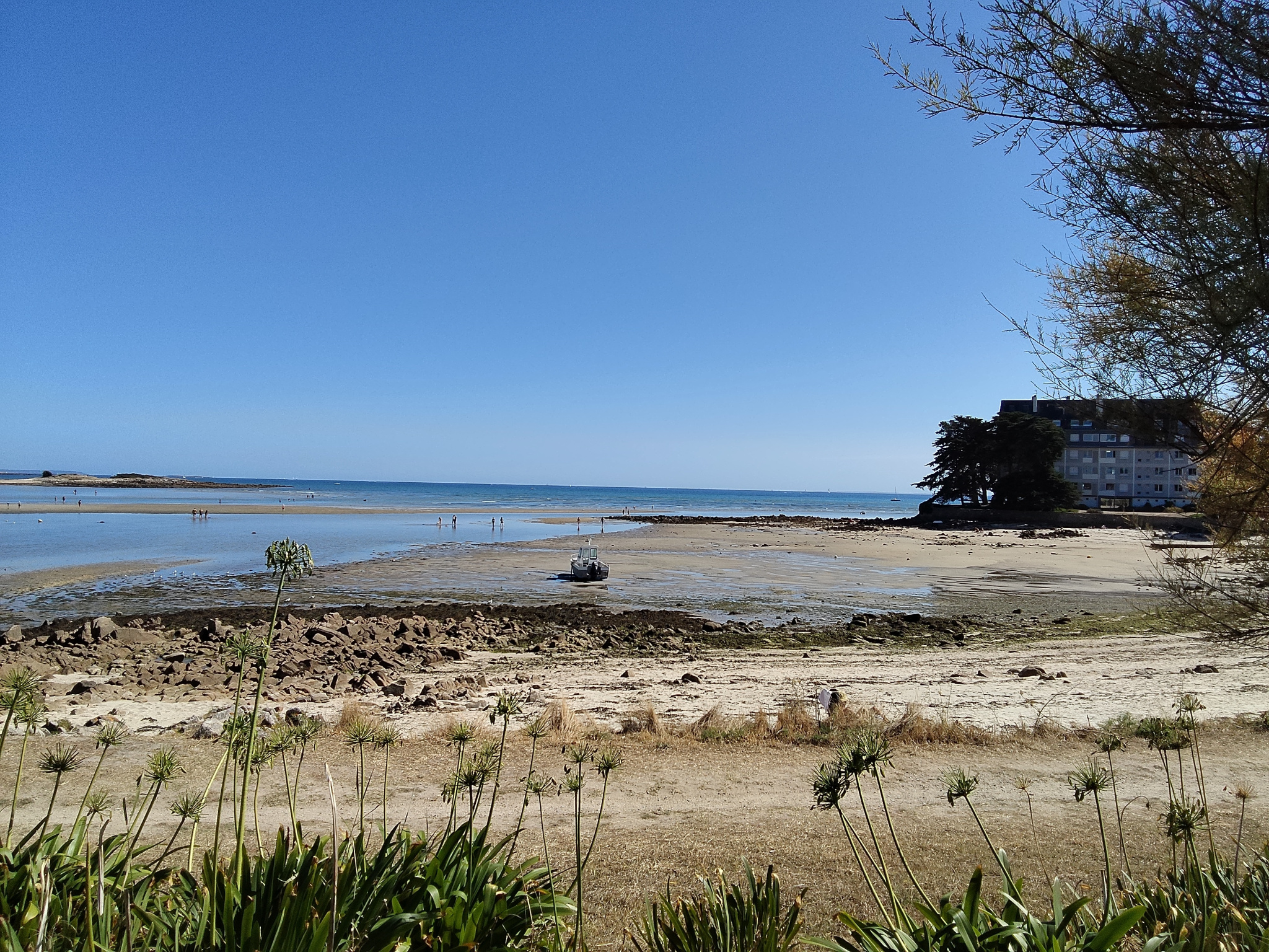 Sea view at Carnac with a beach and people in the water.
