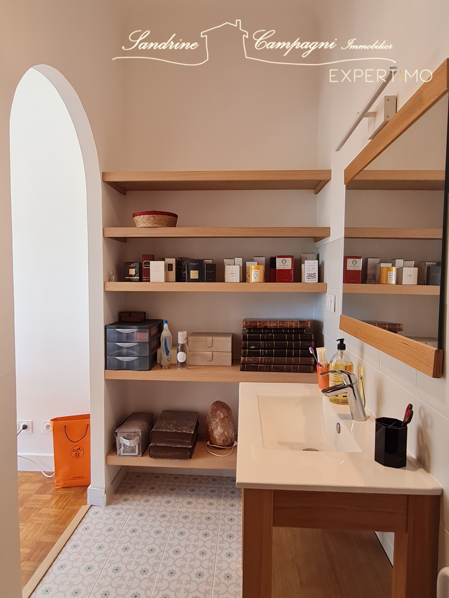 Renovated bathroom Interior of a renovated bathroom with shelves and sink.