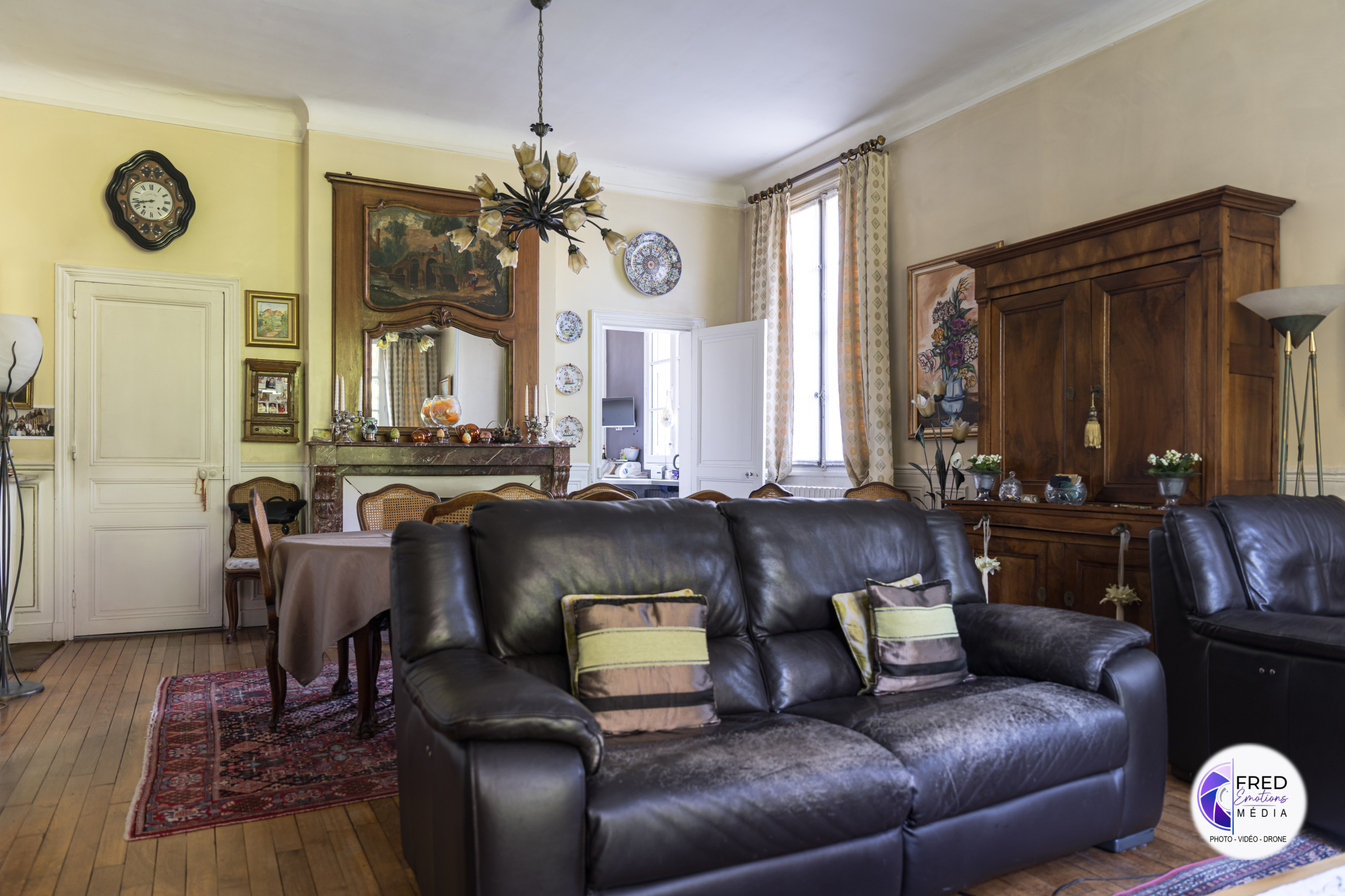 Interior of a bourgeois house in Noyon Interior of a bourgeois house with living room and dining room, wooden furniture and classic decoration.