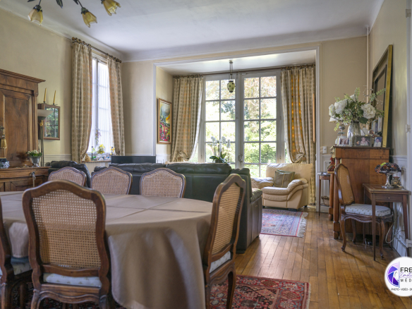 Interior of a bourgeois house in Noyon with a bright living room and antique furniture.