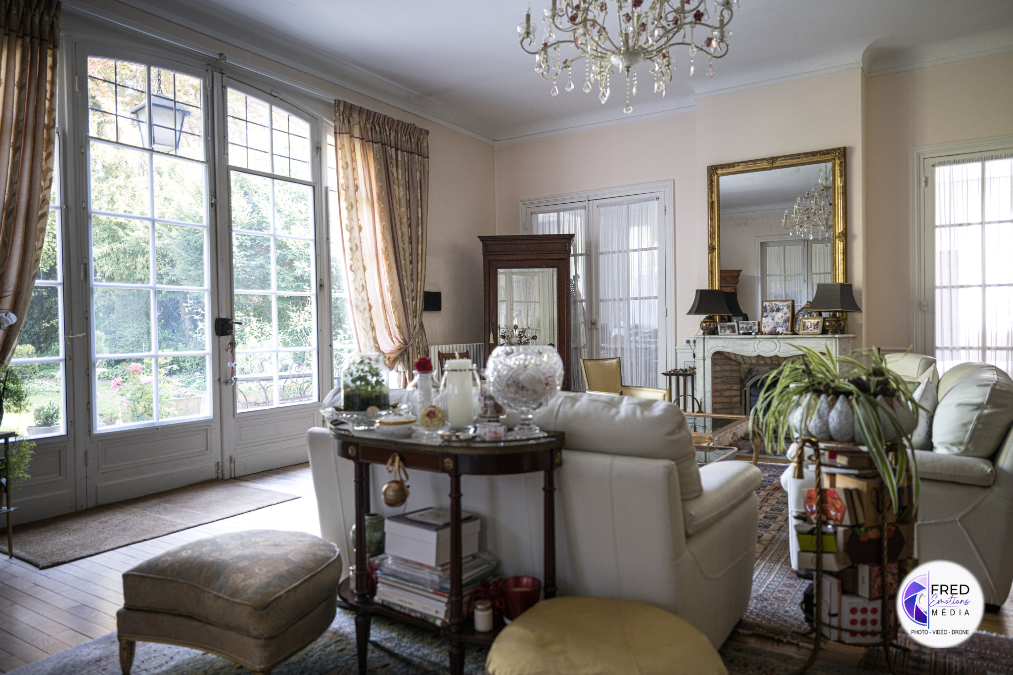 Living room of a bourgeois house in Noyon Interior of a bourgeois house with a bright living room, windows and elegant furniture.