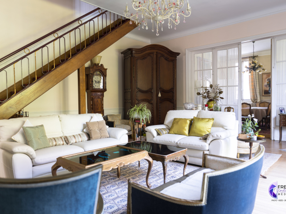 Interior of a bourgeois house in Noyon, living room with sofa and elegant furniture.