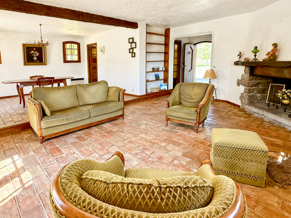 Interior of a family property with living room and fireplace in Tourrettes-sur-Loup.