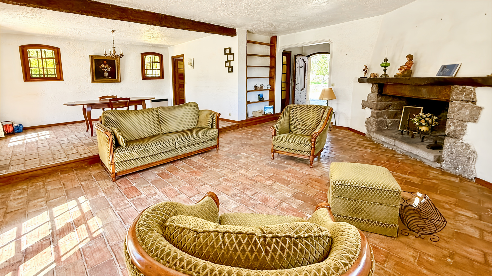 Interior of a family property with living room and fireplace in Tourrettes-sur-Loup.