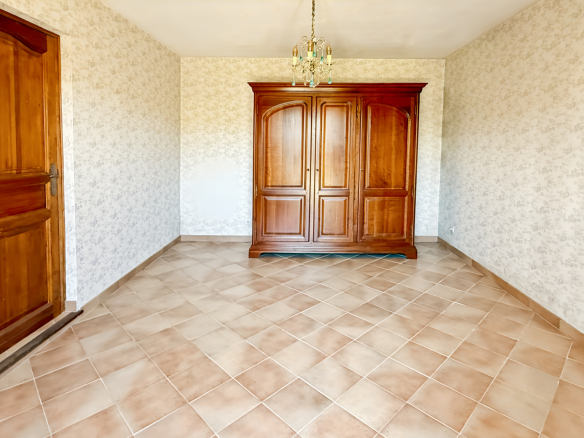 Interior of a property in Tourrettes-sur-Loup with tiled floor and wooden furniture.