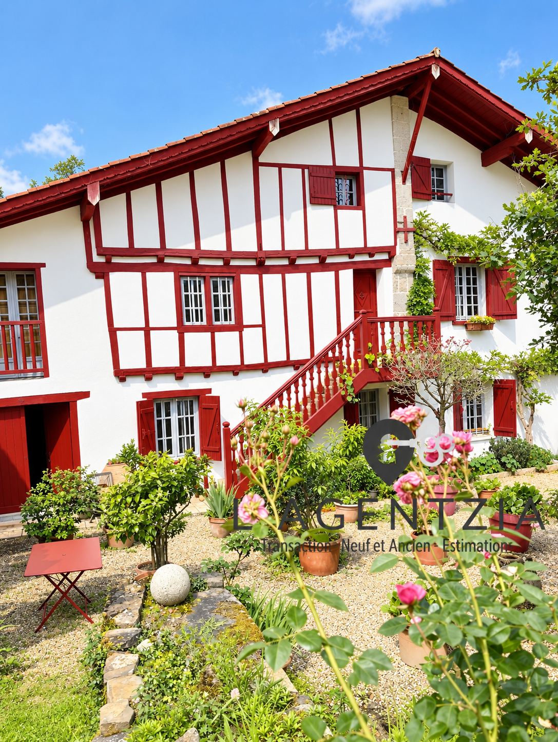 17th century half-timbered Labourdine farmhouse in Cambo-les-Bains, surrounded by greenery.