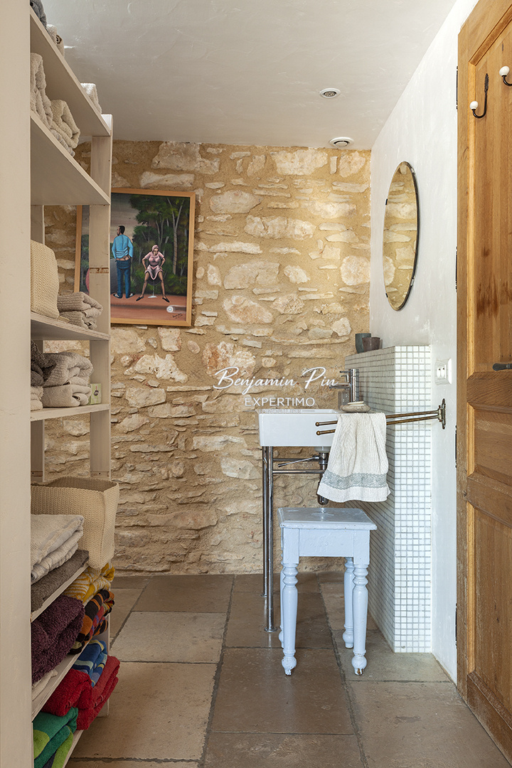Interior of a house in Villars Interior of a renovated stone house with towels and a mirror.