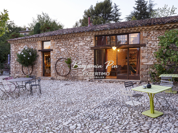Renovated stone house with swimming pool and garden in Villars, surrounded by cobbled streets.