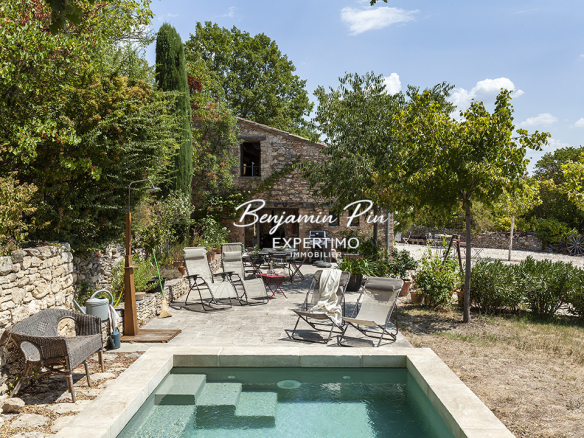 Stone house with swimming pool on wooded grounds in Villars, renovated in 2007.