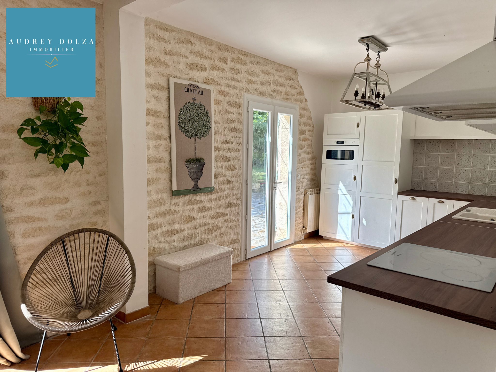 Spacious kitchen in a property in Salon-de-Provence Interior of a spacious kitchen with a wood-burning stove and stone elements in Salon-de-Provence.