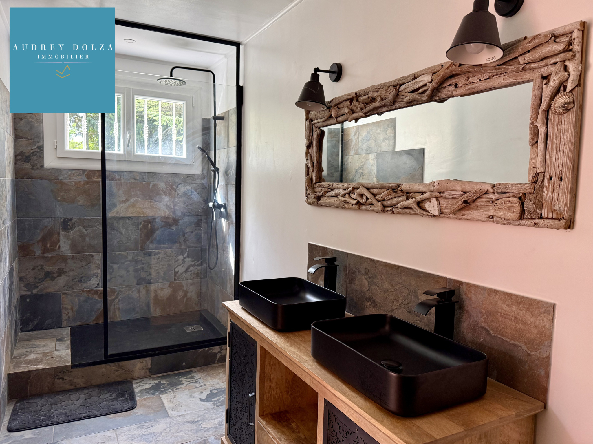 Bathroom in the property in Salon-de-Provence Modern bathroom with walk-in shower and double sink.