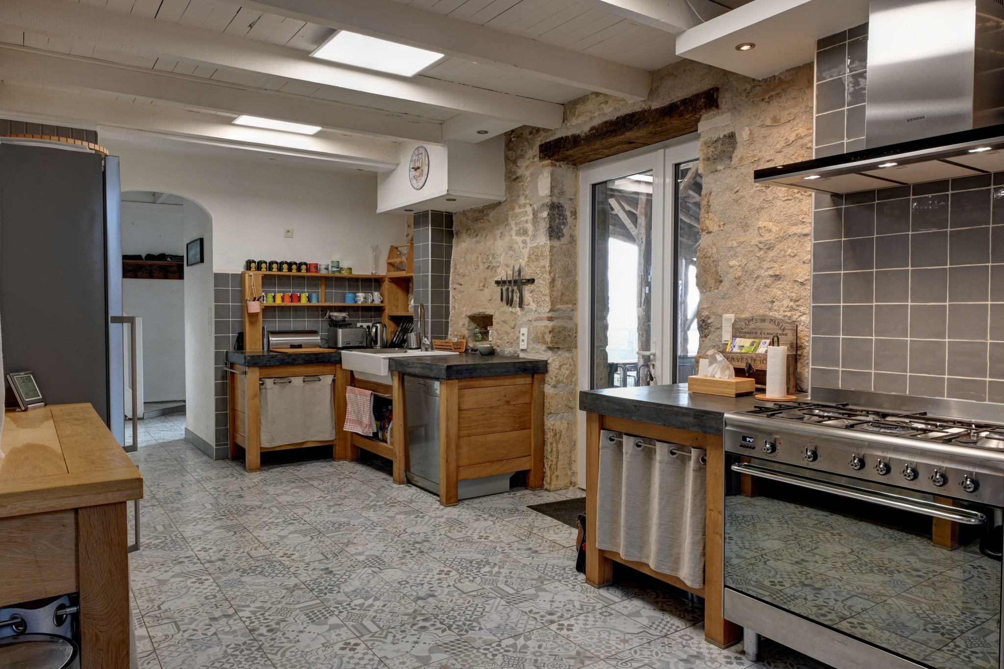 Kitchen in a stone estate Kitchen in a stone house with antique features and modern equipment.
