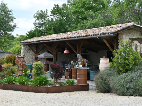 Traditional style building with landscaping, housing equestrian equipment.