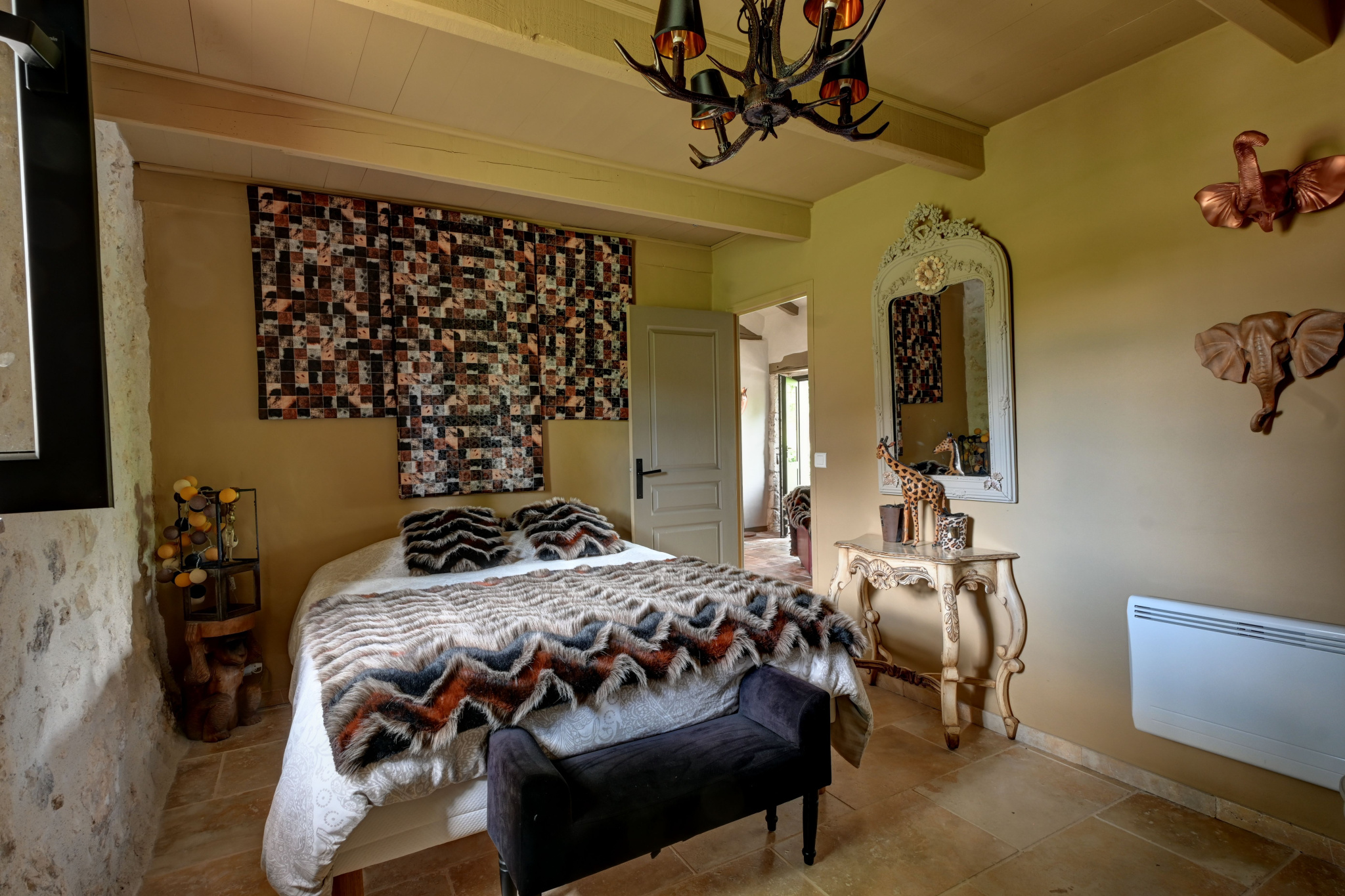 Guest room in a prestigious property Guest house bedroom with elegant decor and comfortable bed.