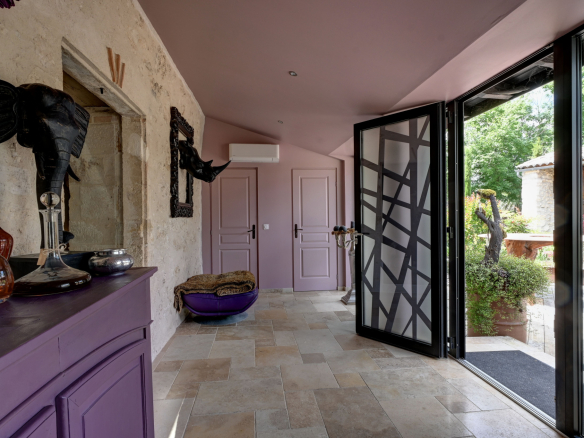 Interior of a prestigious property with elegant decor and glass doors.