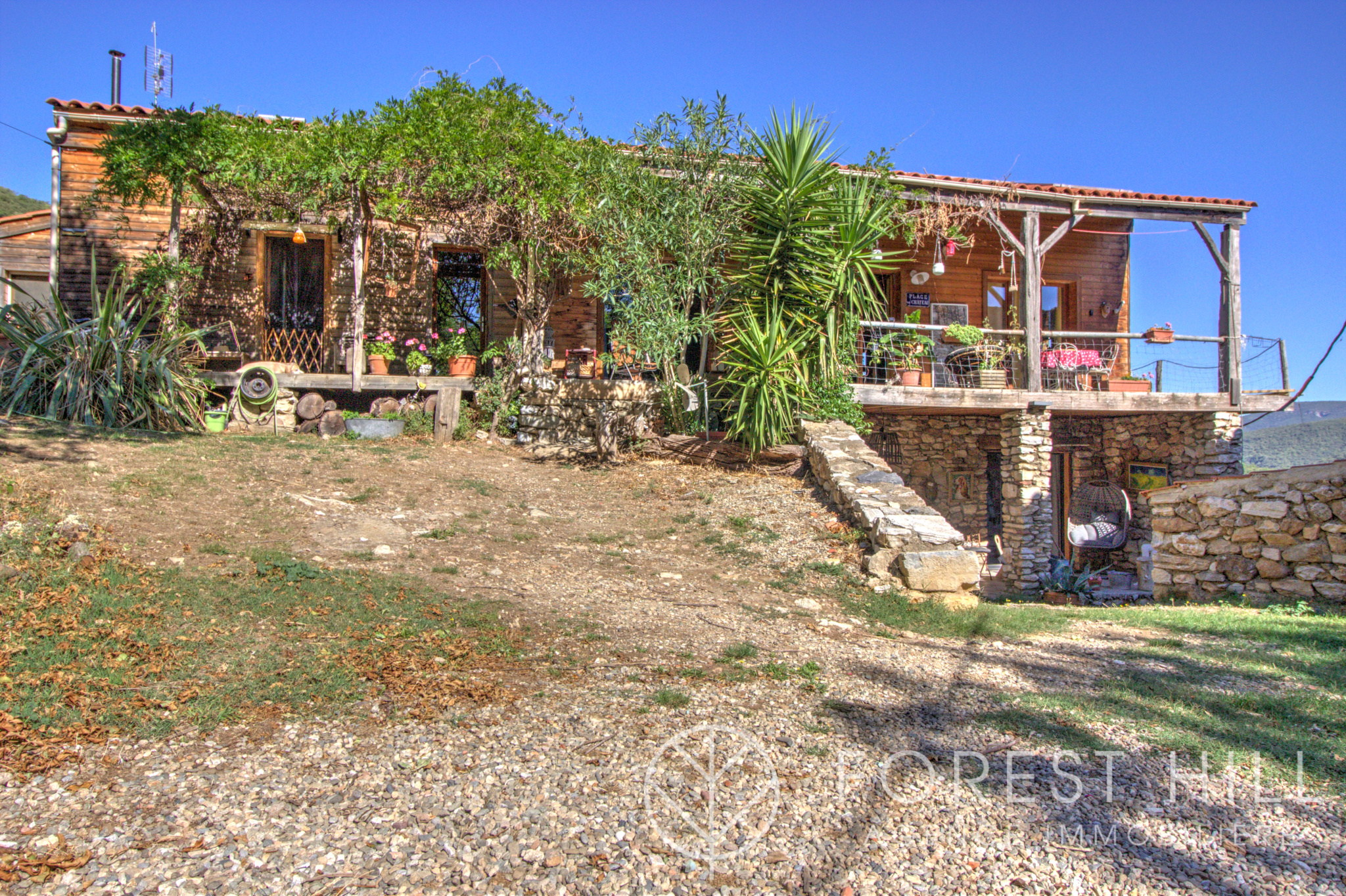Wooden house with terrace and garden in a natural setting in Montbolo.