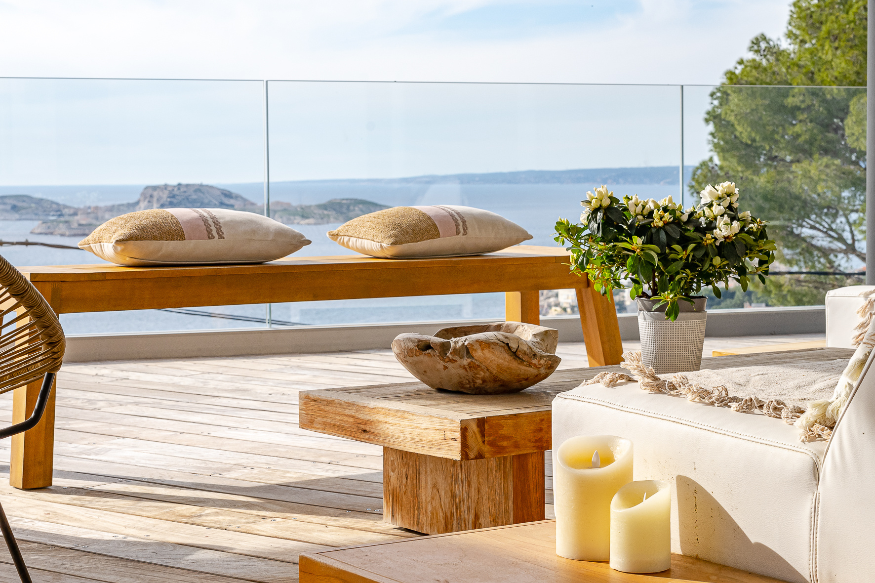 Terrace with sea view in Marseille Terrace of a modern villa with sea view, wooden furniture and elegant decoration.