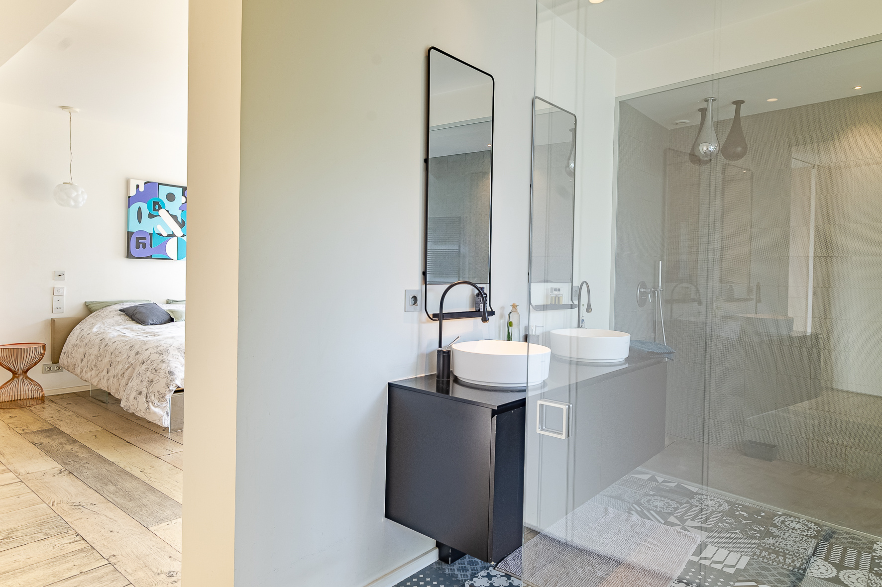 Contemporary bathroom Modern bathroom with double vanity and glass shower, overlooking the bedroom
